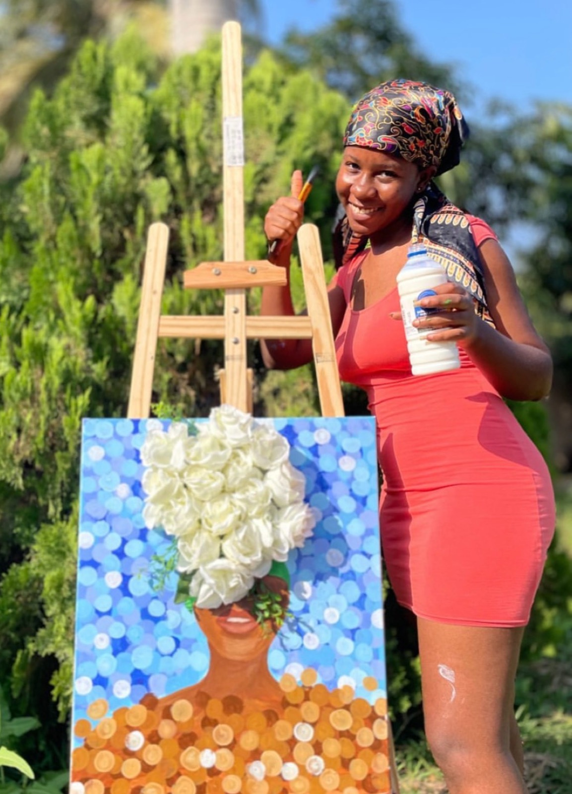 Artist with her painting at Her Expressed